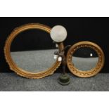 A Regency reproduction convex wall mirror, applied with spheres, 41cm diameter overall; another