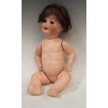 A Heubach Koppelsdorf bisque head doll, blue closing eyes, open mouth with teeth, brown wig,