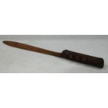 A 19th century Black Forest novelty letter opener, the handle carved with three pug dog heads, their