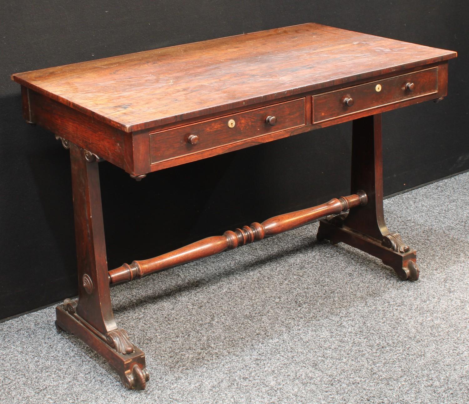 A George IV rosewood rectangular library table, well figured top above a pair of cockbeaded frieze