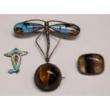 A sterling silver and Blue John brooch; a silver tiger's eye brooch; a silver dragonfly brooch; a