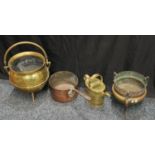 A brass cauldron coal scuttle; a large copper jam pan; a brass watering can; a pierced brass