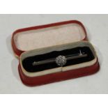 An 18ct white gold diamond brooch, boxed