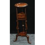 A mahogany tripod jardiniere stand, moulded top, spirally fluted supports, pair of triangular