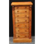 A Victorian walnut Wellington chest, rectangular top above seven graduated drawers, restrained by