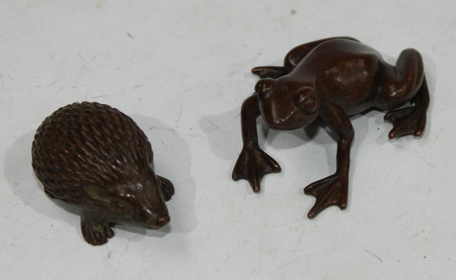 A miniature bronze, of a hedgehog; another, of a frog (2)