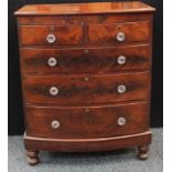A Victorian mahogany bowfront chest, two short over three long graduated drawers, turned bun feet,