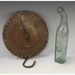 A Salter brass Milk Balance scale, No57, 26cm diameter; a green tinged glass grape storing bottle,