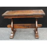 An oak drawer-leaf refectory dining table.