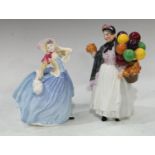 A Royal Doulton figure, Autumn Breezes, HN3736; another, Biddy Penny Farthing, HN1843 (2)
