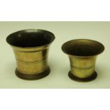 An 18th century bronze mortar, of typical form, 14cm diam, c. 1750; another, similar, (2)