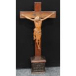 A large 19th century French boxwood Corpus Christi, oak crucifix and pedestal, the frieze of which