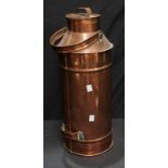A tall cylindrical copper milk churn.