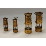 Mining Interest - four miniature brass and copper mining lamps, each boxed (4)