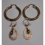 A pair of 9ct gold earrings; another pair of 9ct gold earrings, 7.6g gross