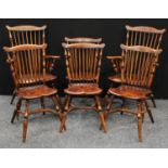 A set of six elm stick-back dining chairs, of Primitive Yorkshire Windsor design, comprising a