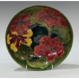 A Moorcroft Hibiscus pattern fruit bowl 26.5cm diameter