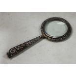 A silver magnifying glass