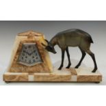 An Art Deco marble mantel clock, surmounted with a gazelle,55cm wide.