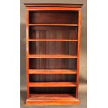 A 'Edwardian' walnut open bookcase, dentil cornice above adjustable shelves, plinth base, 208cm