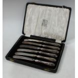 A cased set of silver handled knives