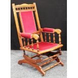 An early 20th century American spring rocking chair, 107cm high