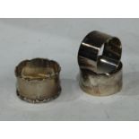 A pair of silver napkin rings, Birmingham 1919; another napkin ring, Sheffield 1903; 91g