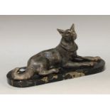An Art Deco spelter model of a reclining Alsatian dog, marble base, marked France, Carvin etched
