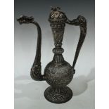 An Indian Kutch silver libation ewer, of Mughal form, domed cover with restraining chain, dragon
