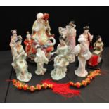 A Chinese porcelain model of an elder, plinth base, 37cm; Japanese costume dolls; others similar;