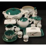 A Denby Green Wheat part dinner and tea service