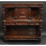 A 17th century style oak credence cupboard, of small proportions, rectangular top above a central