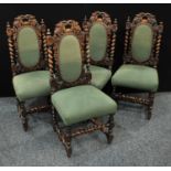 A set of four Jacobean style oak dining side chairs, carved splat with fruiting vines flanked with
