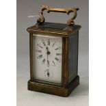 A 19th century French brass alarm carriage clock, the white dial with Roman numerals, subsidiary