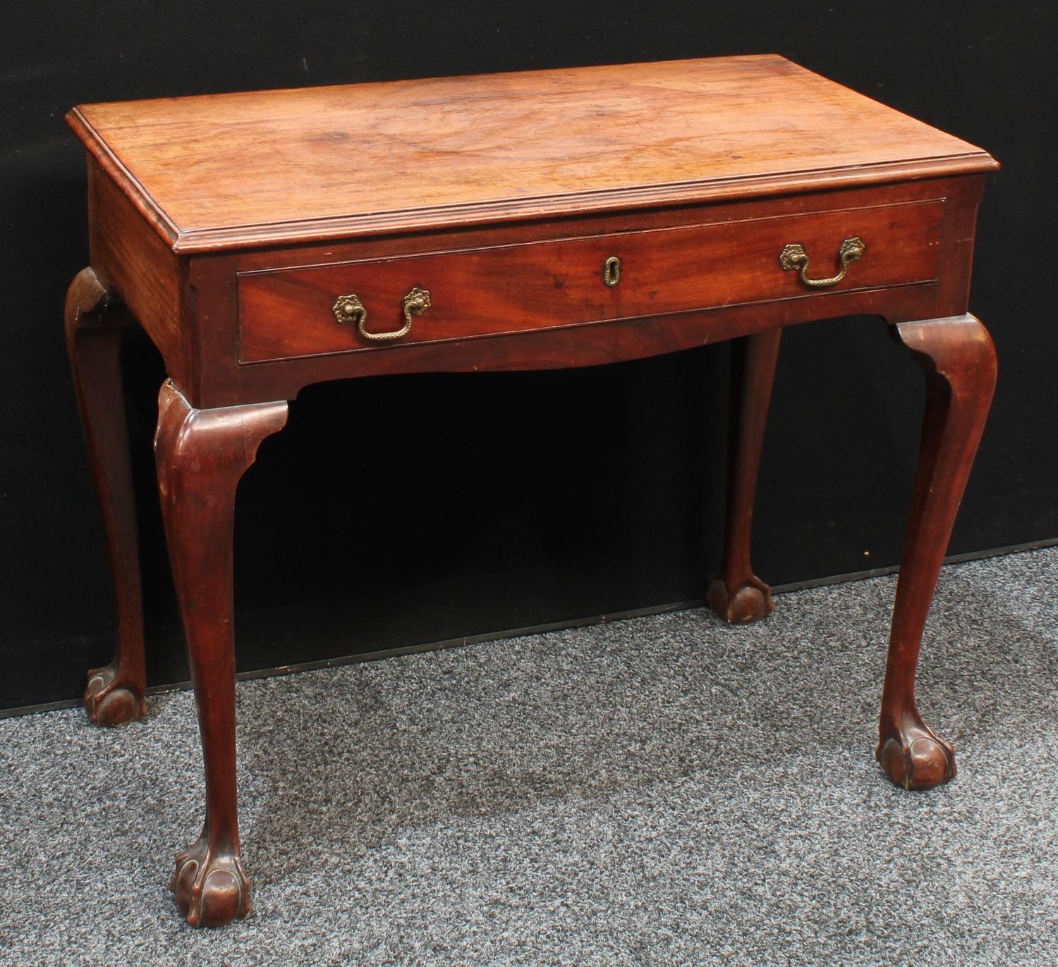A George II mahogany side table, moulded rectangular top above a long frieze drawer, brass Rococo