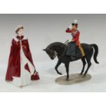 A Royal Worcester figurine, Queen Elizabeth II, dressed in robes of The Order of The British Empire;