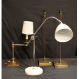 A contemporary chrome adjustable desk lamp; another similar; a pair of table lamps (4)