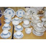 A Royal Worcester Bernina pattern part tea service comprising a tea pot, teacups & saucers, side