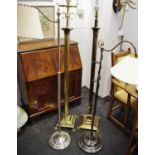 A brass standard lamp with Corinthian column; another; a modern telescopic standard lamp; another