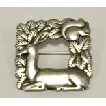 A Georg Jensen 925 square 'recumbent deer and squirrel' brooch, design no. 318