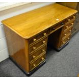 A satinwood knee hole desk, moulded rectangular top, an arrangement of nine drawers. 76cm high x