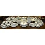 An extensive Royal Worcester Woodland pattern eight setting dinner service, including oval meat