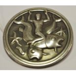 A Georg Jensen silver brooch, the circular design depicting a man riding a fish, stamped 285