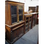 Three mahogany bookcase tops with glazed doors; a Victorian mahogany bookcase base (4)