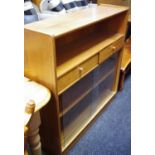 A teak Nathan bookcase, open bookshelf over two short drawers and two sliding glass doors