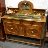 A 1920/30's oak mirror back sideboard, two short drawers over two door cupboard, bobbin turned