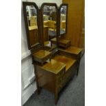 An Edwardian Sheraton Revival dressing chest, foxed trio of mirrors above two short flanked