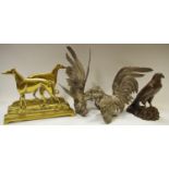 Two brass doorstops cast as greyhounds, Coomsie & Master McGrath, two plated table cockerels; a