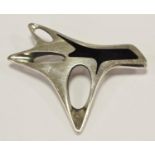 A Henning Koppel for Georg Jensen sterling and black enamel modernist brooch, design no. 323,