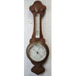 An oak wall barometer